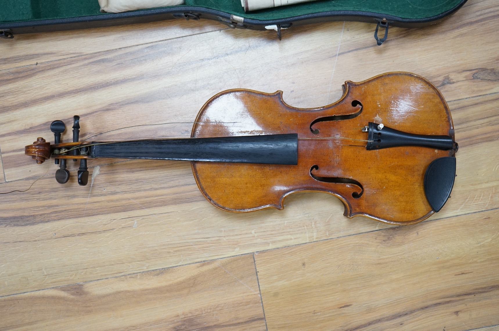 A cased full length violin, circa 1900, with bow, bears Stradivarius label to the interior. CITES Submission reference WVME8714